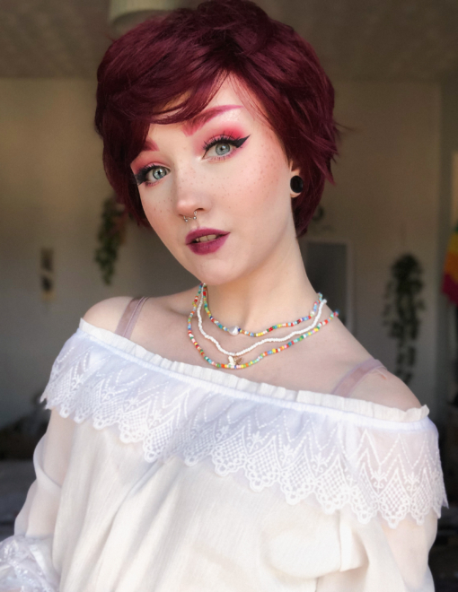 Red short pixie cut wig with bangs. Short and sweet is Cherry, our pixie cut that's hard to ignore with its choppy layers, giving texture and volume to the burgundy red colour. Style for that natural look or mess it up for maximum impact.