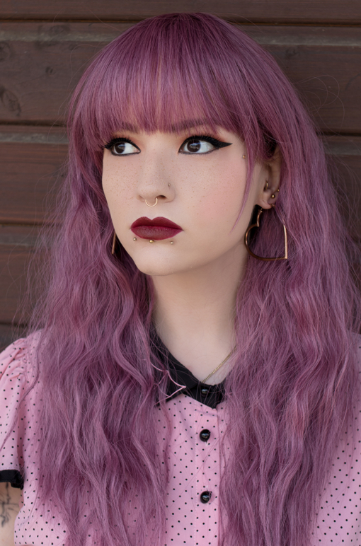 Bloom has a deep lilac pink hue from roots to tips. Think of braids let loose to create volumes of invisible layers and a full fringe to peep from under. Falls just to the waist, add your own individual look with styling and dressing.