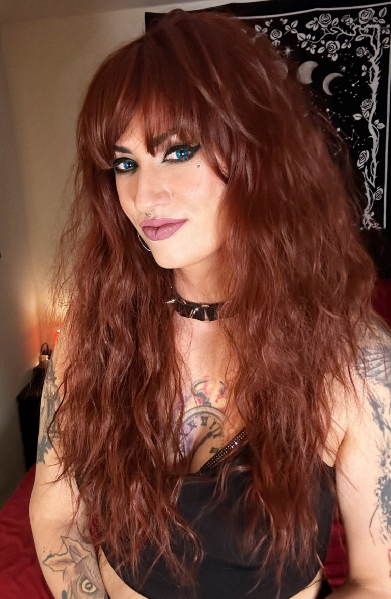 Babooshka - Lush Wigs UK Babooshka is a rich auburn hue with a dash of paprika from roots to tips. Think of braids let loose to create mermaid waves that falls just to the waist. The long sleek fringe allows the freedom to choose between straight across bangs or more of a side fringe.