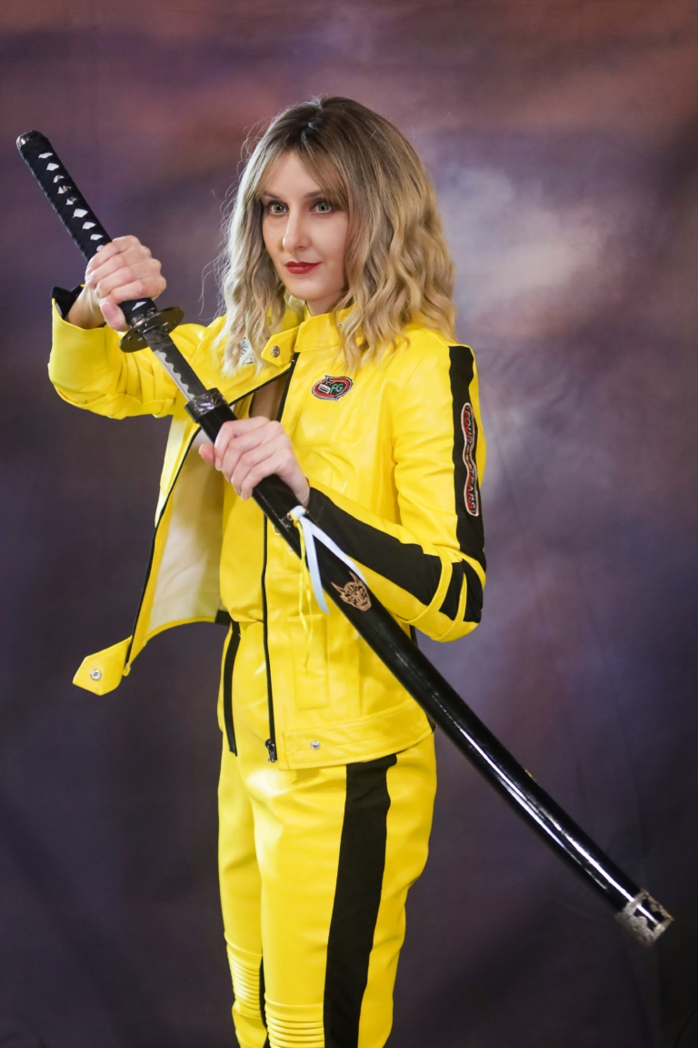 This bob is coloured in a honey blonde tone with brown shadowed roots. That gives a natural feel to the look. A loose wave and a sleek fringe finishes the look.