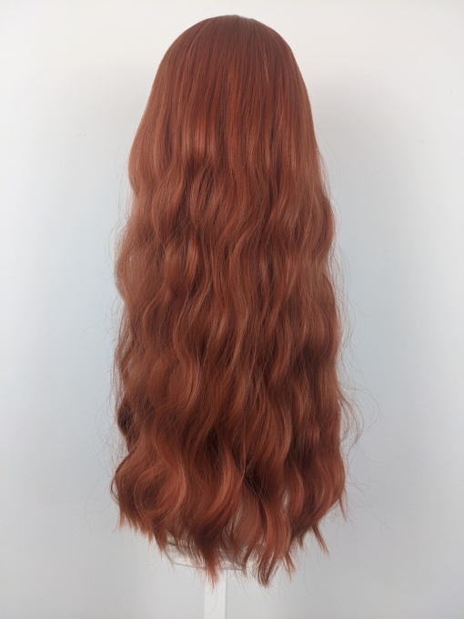 Golden tones make Alba. With its relaxed tousled waves that fall to the waist. Ginger hues with a splash of apricot for warmth. This gorgeous colour runs from roots to tips. A sleek airy fringe finishes the look.