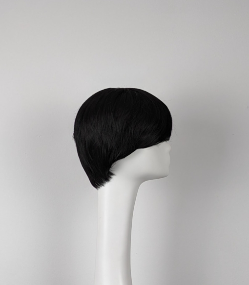 Our shortest pixie style yet. Char is as black as soot from roots to tips. Cut in short layers to the nape of the neck. Wear it brushed forward for that Mary Quant mod look, or swept to the side to create layers.