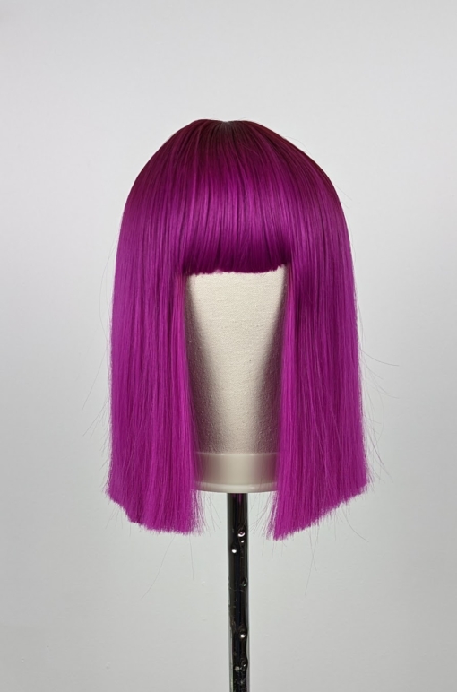 Pink lob with dark magenta roots melt into a shocking pink in a dead straight style. Long Lob with a full fringe to peep from under.