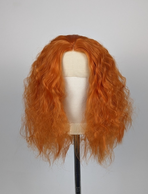This fringe-less lace front natural wig. Comes in a spicy ginger tone from roots to tips. Styled in tight curls that resemble a crimped effect. It can be worn as it is or gently brushed for a softer, fuller look.