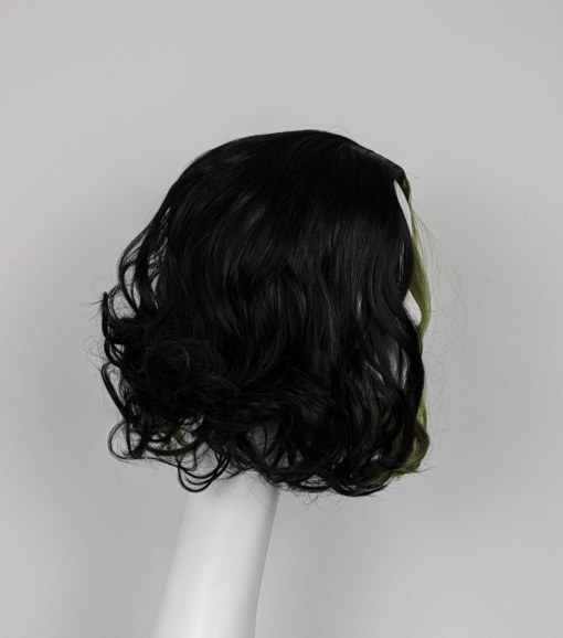 Green and black split colour wig. This dishevelled bob has plenty of volume and bounce.