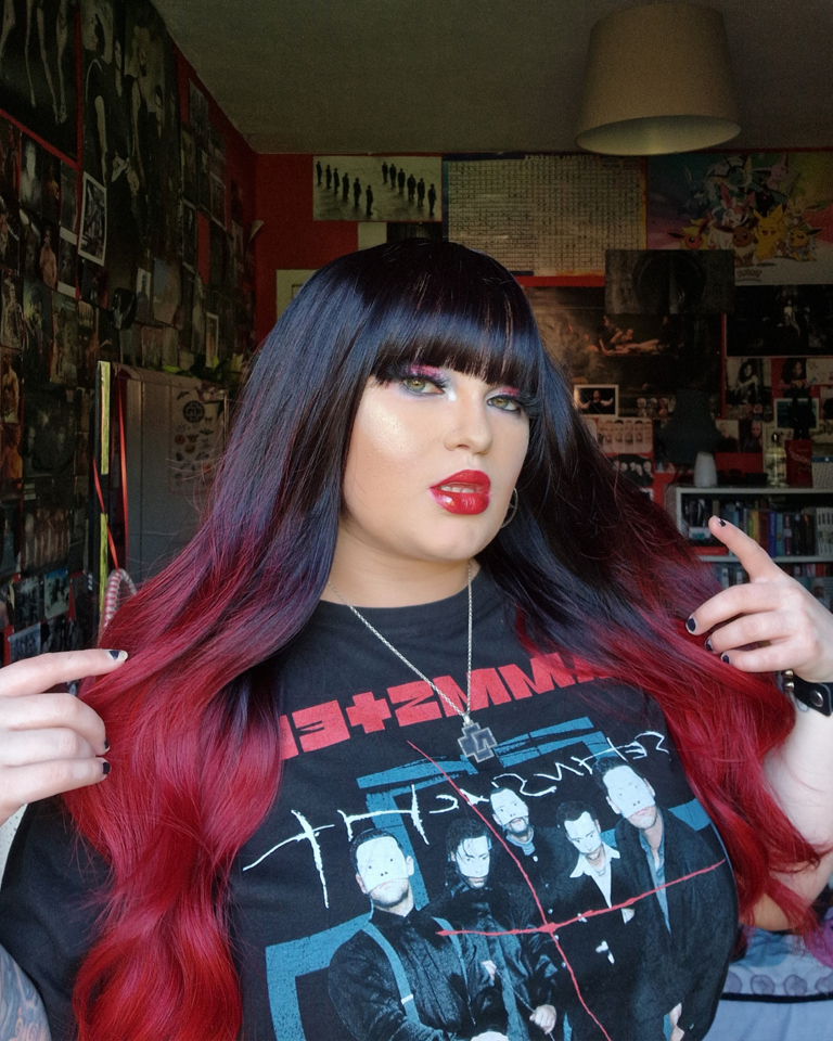 Black and red go together in perfect harmony. Cinnabar is our latest ombre of cool black and wine red. Styled in a blow out with long layers for movement. A blunt fringe frames the face.