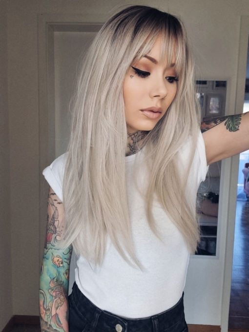 Maddy is one of our natural styles. A sleek straight style in a diamond blonde colour. With dark brown shadowed roots. Cut into long layers to add fullness and movement. An airy fringe frames the face.