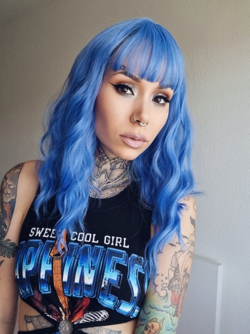 Blue Crush comes in a beautiful bright blue shade from roots to tips. Styled in loose waves that fall below the shoulders. A vivid bright bold look.
