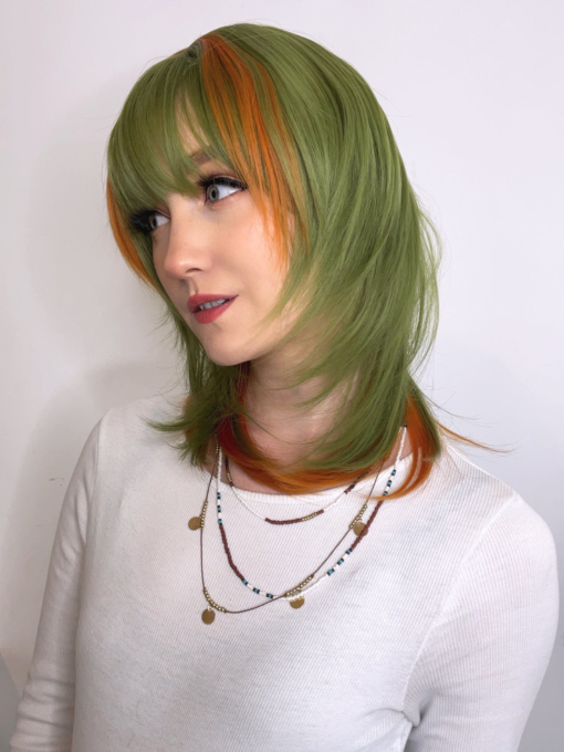 Super cute, unique and fresh. A shaggy cut style in a earthy green colour with highlights of burnt orange.
