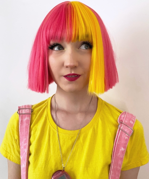 Bright hot pink bob with a fun pop of yellow at the front. Perfect for those who want something bouncy, cute & striking!