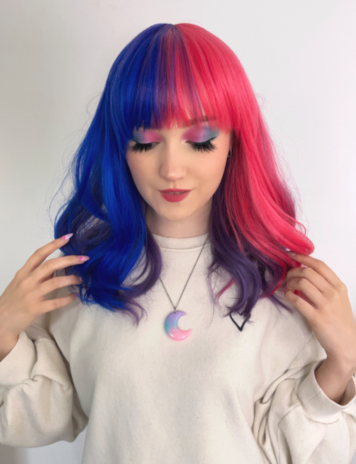 This is a sure standout style! It features three colours - pink, blue & purple - the same colours used in the bisexual pride flag. The pink and blue are split at the front with a dusky purple filling the back of the wig.