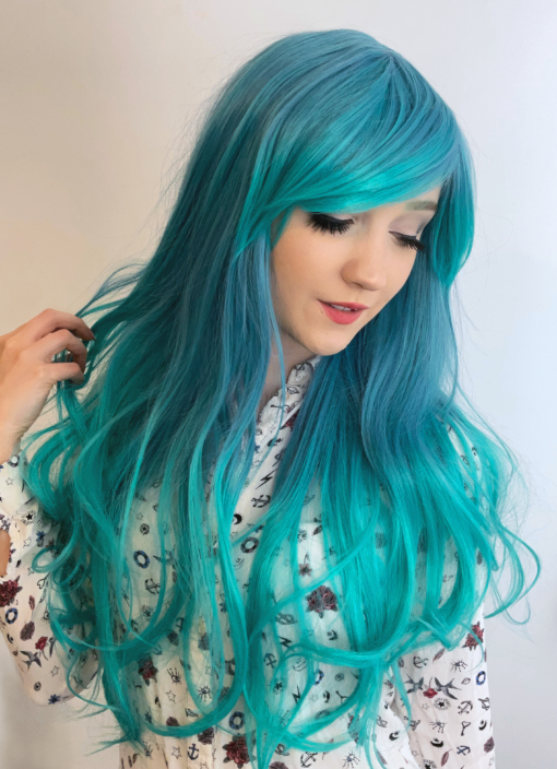Shades of blue fade into a lush turquoise at the ends. Subtle waves and layers add shape & body. A longer fringe can be styled to suit you - however you want to wear it. This wig is perfect for styling into something voluminous with those big iconic swoopy bangs.