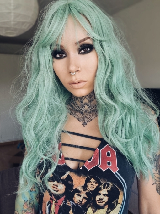 Aqua green from roots to tips, seagrass comes in loose braided waves. Long layers and a sleek fringe. This look is a staple for any mermaid wannabes.