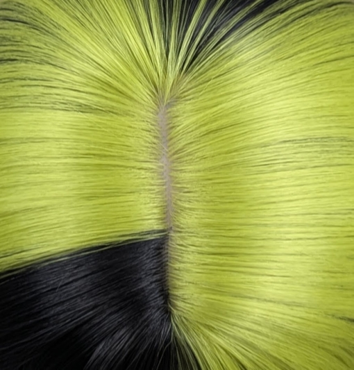 Aurora - Lush Wigs UK Blocks of leaf green colour are carried through the black lengths of this sleek long bob. Sleek and choppy with lots of layers. The green colour is carried into the fringe and on top of the head. Lots of green undertones for a peek-a-boo effect.