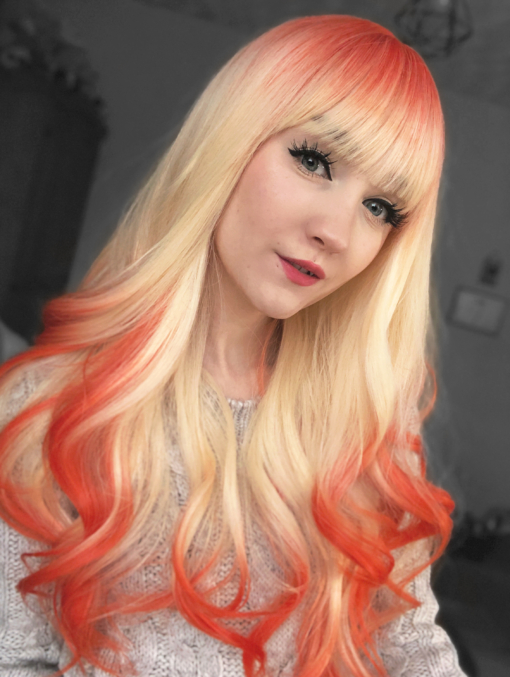 This natural twist bleach blonde wig with bright orange roots and dip dye at the ends. A sleek long style with layers for movement and bounce. With a full fringe to peep from under.