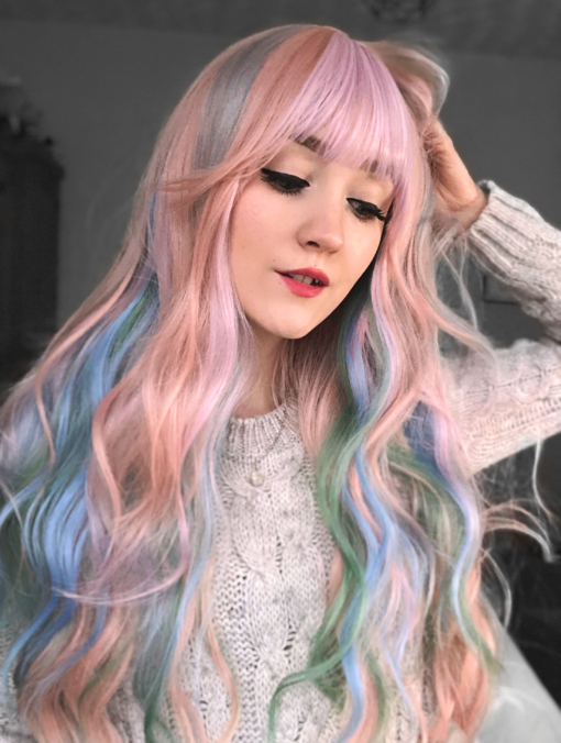 Confetti is a mixture of many pastel colours. Peach, lilacs, blues and greens. Long and curly with invisible layers for bounce with a full fringe to frame the face.