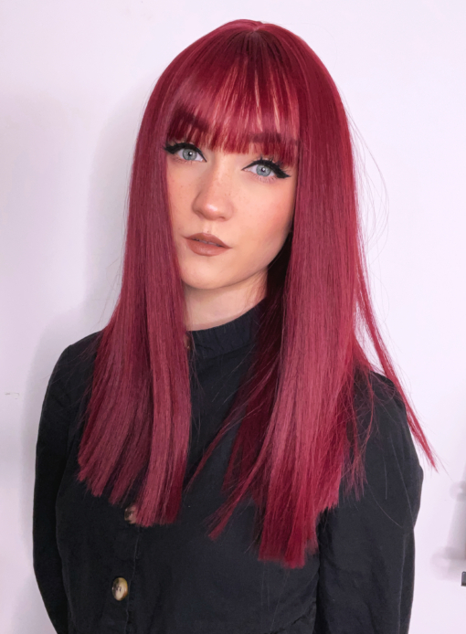 This vibrant and rich colour comes in a deep cherry shade, from roots to tips. A sleek blunt cut falls just below the shoulders with an airy fringe to frame the face.