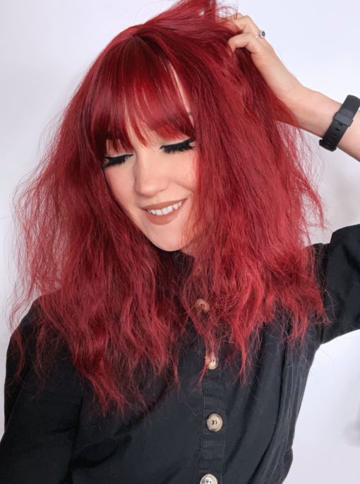 This vibrant and rich colour comes in a deep cherry shade, from roots to tips. A crimped wave for a fluffy effect. Styled in a long bob (lob) with a sleek airy fringe to frame the face.