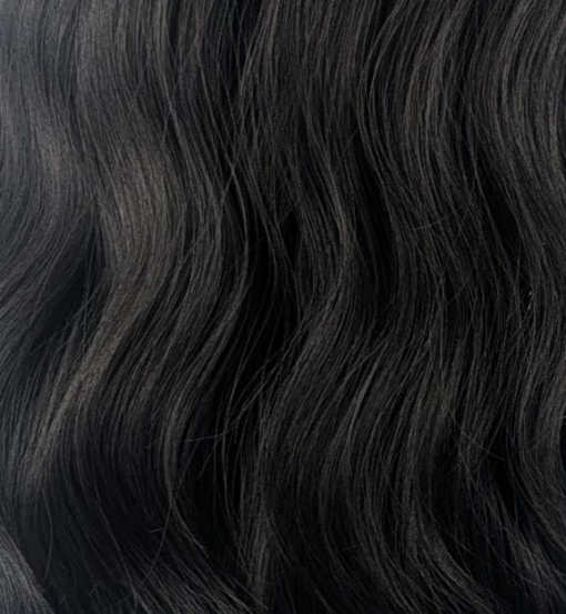 Susie - Lush Wigs UK A Natural dark brown colour from roots to tips. This fringeless long bob (lob) styled in loose waves with a centre parting.