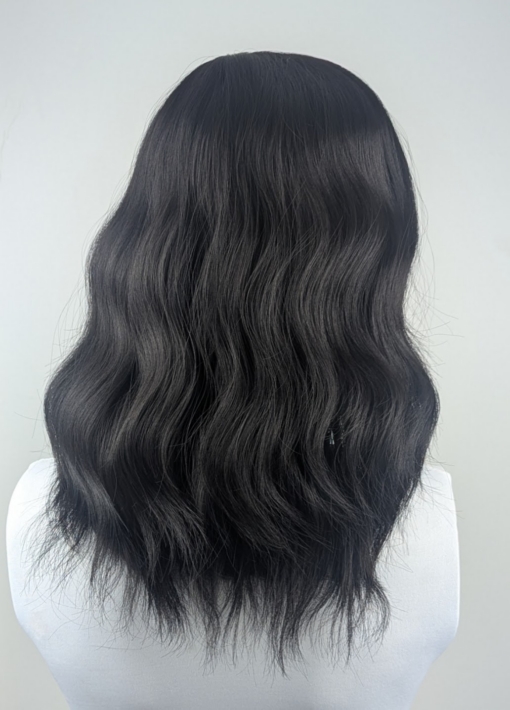 Susie - Lush Wigs UK A Natural dark brown colour from roots to tips. This fringeless long bob (lob) styled in loose waves with a centre parting.