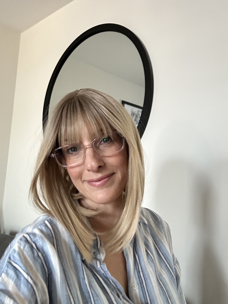 Myrtle - Lush Wigs UK This sandy natural blonde wig is simple and chic. Brown shadowed roots melt into a blonde hue with sun-kissed tips that create the perfect shades for a natural look. A straight one-length bob that curls under at the ends.