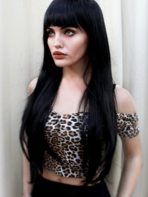 Winter - Lush Wigs UK Winter is a natural warm black colour from roots to tips. A barely there wave running through the lengths. With invisible layers cut in for movement and shape. A blunt sleek fringe completes the look.