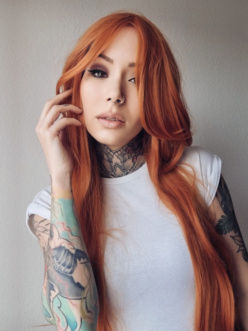Clementine dreams is a bohemian style in a bold burnt orange colour from roots to tips. A very long and sleek wig with invisible layers that fall just past the hips. The fringe is long and thick. Wear it swept to the side or parted for long curtain bangs.