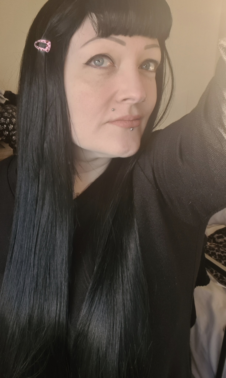 Winter - Lush Wigs UK Winter is a natural warm black colour from roots to tips. A barely there wave running through the lengths. With invisible layers cut in for movement and shape. A blunt sleek fringe completes the look.