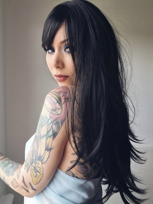 Winter - Lush Wigs UK Winter is a natural warm black colour from roots to tips. A barely there wave running through the lengths. With invisible layers cut in for movement and shape. A blunt sleek fringe completes the look.