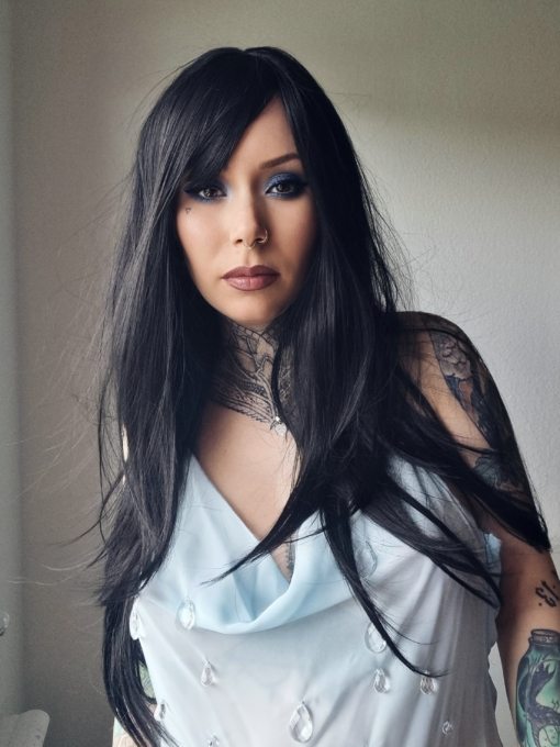 Winter - Lush Wigs UK Winter is a natural warm black colour from roots to tips. A barely there wave running through the lengths. With invisible layers cut in for movement and shape. A blunt sleek fringe completes the look.