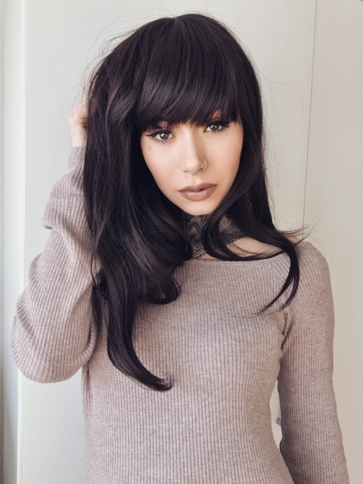 Dark chocolate is a natural brown-black colour from roots to tips. Sleek long layers are styled in a blow out for volume. Its long thick full fringe can be cut to suit the wearer.