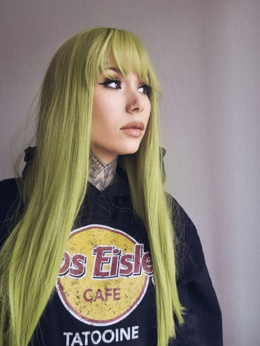 A straight long vibrant wig in a swampy green colour from roots to tip.
