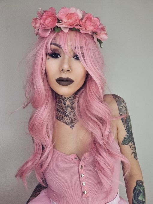 Pink from roots to tips. A blend of light pink and white stands of hair make this rose pink colour, from roots to tips. Styled in waves that fall to the waist. The light fringe finishes the look.