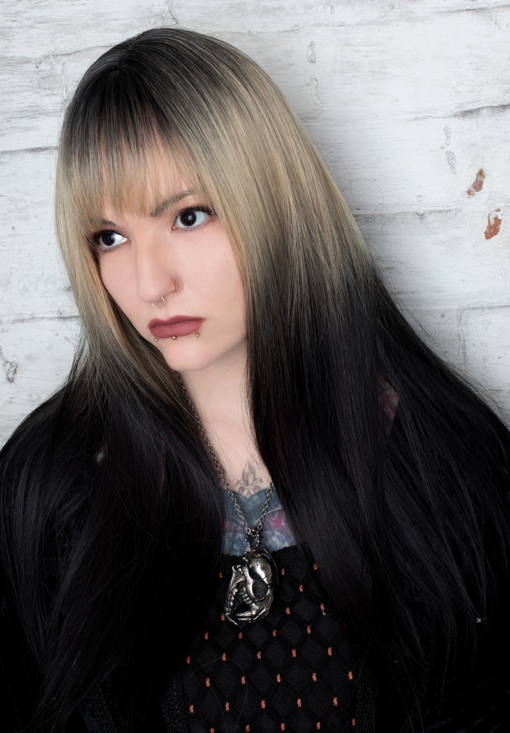 This cool black ombre with dark black and blonde shadowed roots give an ash feel to the colour. It's Blonde tone wakes up this ombre sleek style. The light fringe carries the colour effect. We love this dramatic natural look.