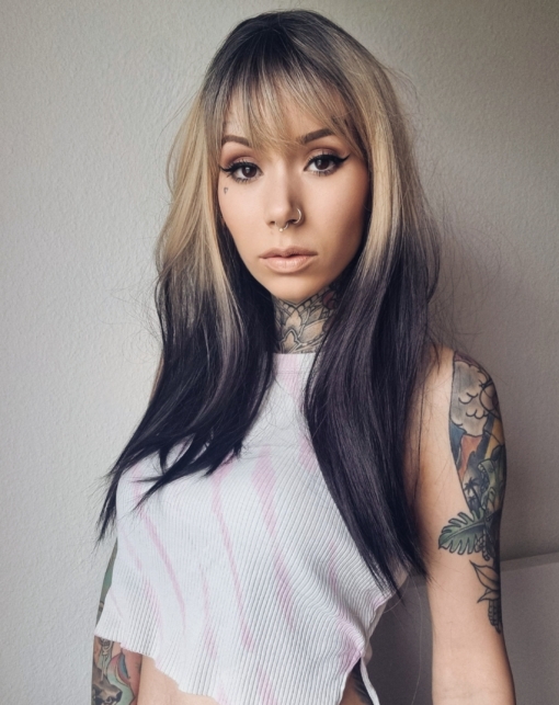This cool black ombre with dark black and blonde shadowed roots give an ash feel to the colour. It's Blonde tone wakes up this ombre sleek style. The light fringe carries the colour effect. We love this dramatic natural look.