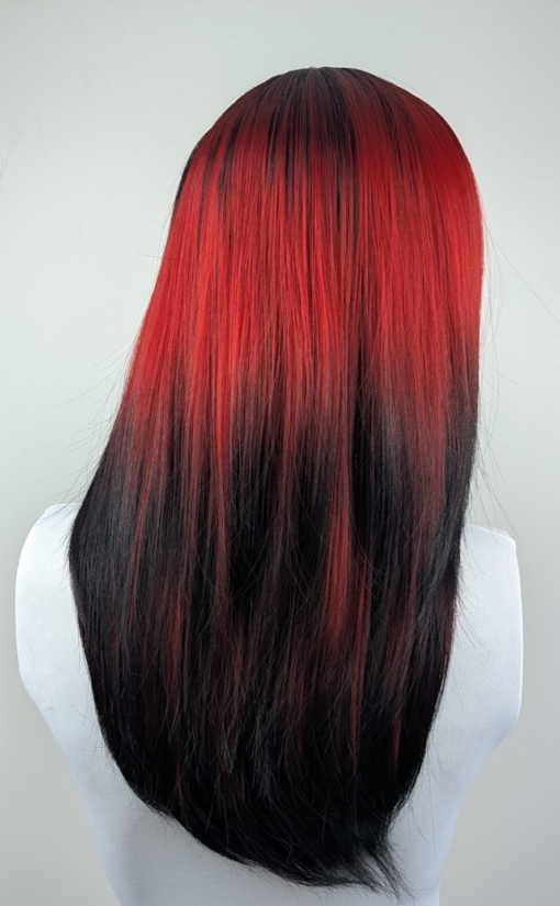 Jekyll - Lush Wigs UK This Reverse Ombré natural twist soft black wig with a deep red pop of colour. Soft black roots blend into this red hue with black tips. A sleek long style with long layers at the back, face framing layers at the front make this style easy to maintain. With a full blunt fringe to peep from under.