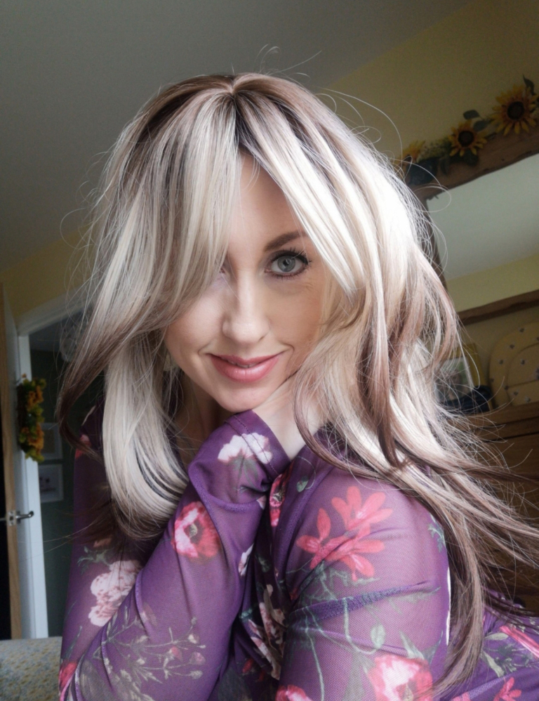 Micah - Lush Wigs UK This natural wig comes in a mix of light brown and blonde roots that blend into a sandy blonde hue. Warm brown ends define the sleek blow-out style. Long layers at the back, with a fringe that can be worn as curtain bangs or swept to one side.