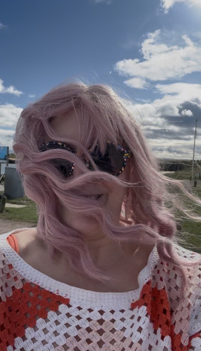 Dazzle - Lush Wigs UK A baby pink and light blonde colour mix make this pastel hue from roots to tips. A long bob styled into a loose wave with a sleek blunt fringe.