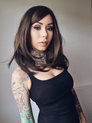 Bruna is a natural mix of auburn and brown to create this beautiful warm colour from roots to tips. Sleek long bob with layers are styled in a blow out for volume. Finished with a blunt fringe.