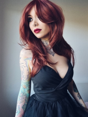 Long and sleek with layers for movement. A muted auburn and ginger colour creates this beautiful hue from roots to tips. A long fringe frames the face and can be worn as long curtin bangs.