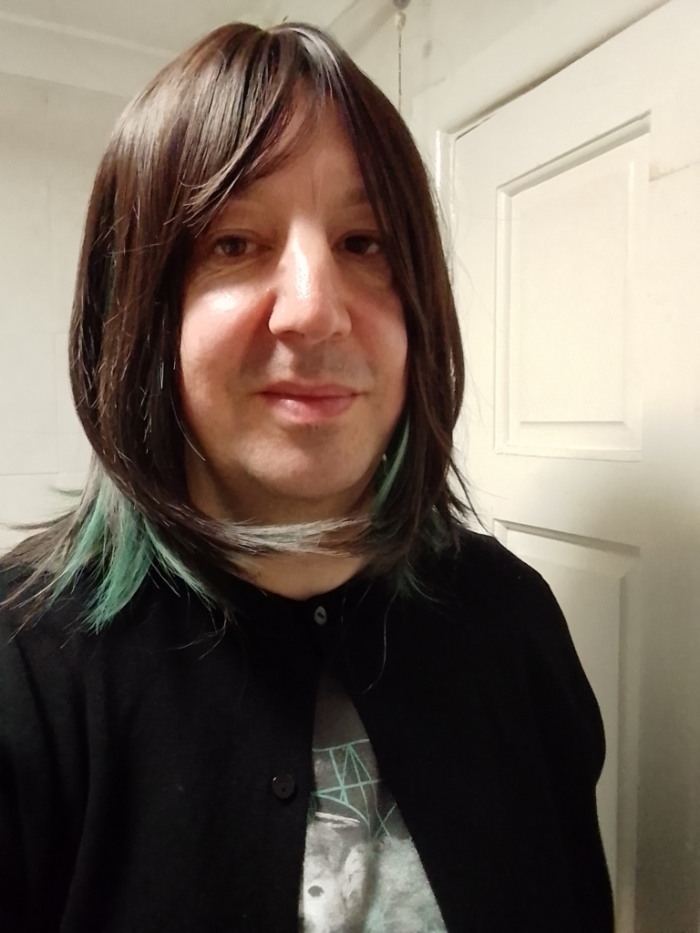 Teleri - Lush Wigs UK This dark brown and sage green wig has the best of both worlds. From the roots and fringe are a dark brown. Underneath lies a sage green for a peek-a-boo effect. Styled into a long sleek bob with layers for added volume.