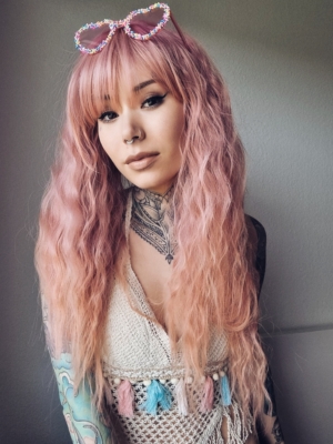 This wig is so fluffy. A soft crimped mermaid waves style in a blend of coral pink that fades into a warm-toned peach. The sleek long fringe is versatile to be worn to suit your look.