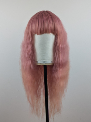 This wig is so fluffy. A soft crimped mermaid waves style in a blend of coral pink that fades into a warm-toned peach. The sleek long fringe is versatile to be worn to suit your look.