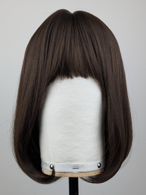 Outlet #156 - Lush Wigs UK A soft and natural warm chestnut tone from roots to tips. A graduated cut that curls under, falling just below the jawline, with a sleek blunt fringe. A simple yet stylish cut that’s easy to maintain.
