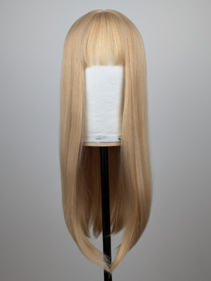 Outlet #157 - Lush Wigs UK A long straight one-length wig that falls to the waist. This natural light honey blonde colour from roots to tips comes with a sleek blunt fringe.