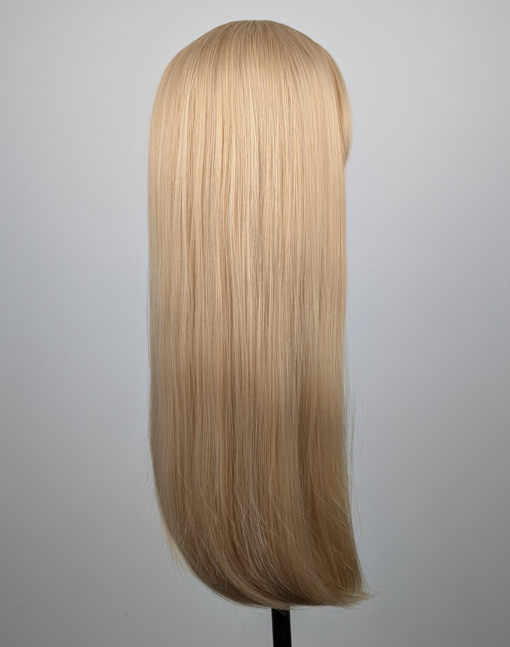 A long straight one-length wig that falls to the waist. This natural light honey blonde colour from roots to tips comes with a sleek blunt fringe.