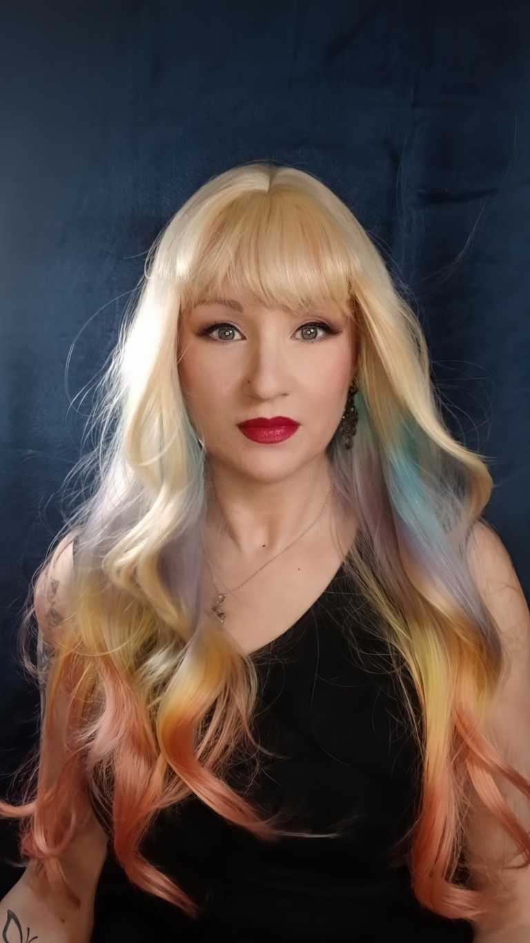 Zeus - Lush Wigs UK This multi-colour wig is a mixture of purple, blues, limes, greens and peach. From the nape of the neck giving a peek-a-boo effect. A natural blonde colour from the roots, thats carried into the sleek blunt fringe. Long and curly with invisible layers for bounce and volume.