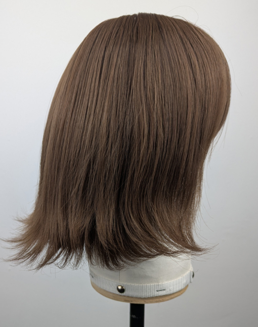 Outlet #159 - Lush Wigs UK This jaw-skimming bob, styled with a gentle flick curl at the ends. Short choppy layers add volume. With a sleek light fringe. A colour mix of warm light browns from roots to tips. Easy to wear and maintain.