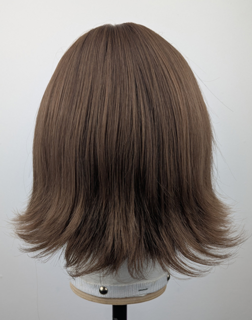 Outlet #159 - Lush Wigs UK This jaw-skimming bob, styled with a gentle flick curl at the ends. Short choppy layers add volume. With a sleek light fringe. A colour mix of warm light browns from roots to tips. Easy to wear and maintain.