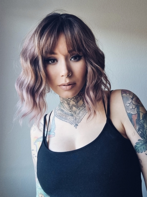 We should let the reviews speak for this one! This natural twist of brown shadowed roots that melt into a muted pink and plum mix ombre. A loose wave bob with a sleek fringe.